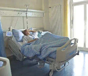 Patient in a hospital bed during inpatient diagnostics